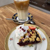 Blueberry crumble cake and iced oat latte  at Cafe Herzstück in Goerlitz