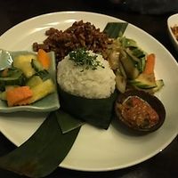 Rice with vegetables, fresh dip and a sweet salad with fruits. at Cafe Bali in Saarbrucken