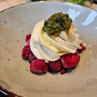 Iced raspberries with coconut cream and mint pesto at Kunstküche in Krefeld