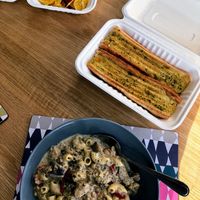 Creamy mushroom and vegan chicken pasta, garlic bread and cheesy nachos at Cafe Shanti in Lincoln