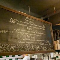 Blackboard with changing daily specials at Gigi Pizzeria in Newtown