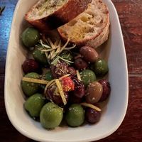 Marinated mixed Italian olives served with homemade bread  at Gigi Pizzeria in Newtown