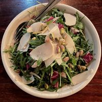 Rucola, Merle E Cannella - Salad of rocket, radicchio, sun dried apple, pistachio, cinnamon, extra virgin oil, shaved Parmesan, sea salt & lemon zest.  at Gigi Pizzeria in Newtown