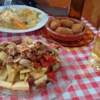 Gf got a stew, I had chips with seitan. Delicious side order of croquettes! at Somos Lo Que Comemos in Tenerife