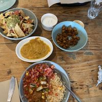 Half eaten cauli (so good!), nachos and jackfruit burrito bowl  at Bay City Burrito in St Kilda