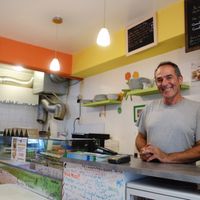 The owner - always smiling, not just in this photo! at Pittz in Aix-en Provence