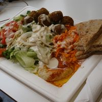 Falafel platter with salad, pita bread, and hummus (vegan) at Pittz in Aix-en Provence