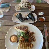 Seitan quesadilla at the front, seaweed wraps in the middle and tofu tacos other side of the table   at VegetaBowl in Koh Tao