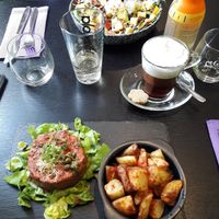 Raw salad, coffee with vegan chantilly, vegan tartare with potatoes at Velicious in Strasbourg