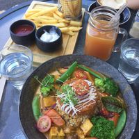 Vegan curry don, Vitamin C juice, potato fries with vegan sour cream at V Series in Kew