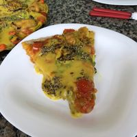 Pizza de queijo de batata, com tomate confit, pimenta biquinho e berinjela empanada  at Cozinha Divina in Olinda