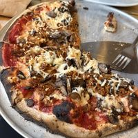 Vegan cheese, vegan sausage, wild mushroom blend pizza   at Wild Tomato Pizza in Fish Creek