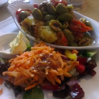 baked potato with olives and tomatoes. vegan butter on request! at Pimento Tea Rooms in Lincoln