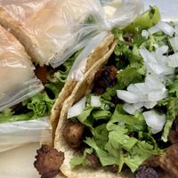 Torta de milanesa con salchicha y taco de suadero  at Gatorta - Food Stand in Mexico City
