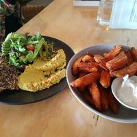 Hummus plate and sweet potato wedges with vegan aioli at The Alkaline Cafe in Albany