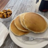 pancakes with a side of breakfast potatoes  at New Leaf Cafe in Tampa
