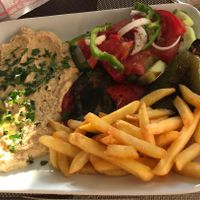 Hummus, grilled vegetables, french fries and salad.  at Kellari in Crete