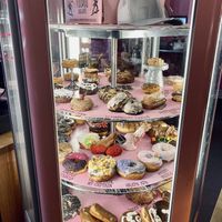 Rotating donut case  at Voodoo Doughnuts - E 6th St in Austin