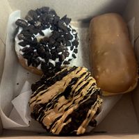 Dirt (top left), Maple Bar (right), Ol Dirty Bastard (bottom) at Voodoo Doughnuts - E 6th St in Austin