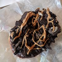 Vegan Old Dirty Bastard - Chocolate glaze with oreos and peanut butter drizzle at Voodoo Doughnuts - E 6th St in Austin