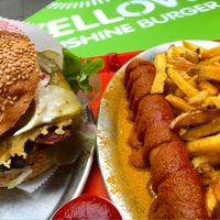 Seitan cheese burger and currywurst with pommes. at Yellow Sunshine in Berlin