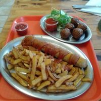 Currywurst and chips with party balls (meatballs) at Yellow Sunshine in Berlin