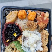 Bento box for 810 with a layer of whole rice underneath at Evah Dining Macrobiotic - JR Hakata in Fukuoka