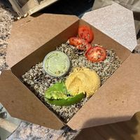 Ordered the avocado delight over quinoa/rice. This is what I got… Looks like bird food. $14 for what? half an avocado and some dressing?  at InfusionTea in Orlando