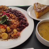 12 EU 'big' meal, including a feijão, tofu stew, pizza slices, vegetable soup and carrot cake. at Escolha Natura in Lisbon