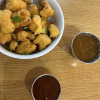 Cauliflower wings with orange saucee  at Next Level Veggie Grill - Hawthorne in Portland