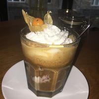 a scoop of vanilla chocolate cherry ice cream with an espresso shot, oat milk and vegan cream  at TONIS in Leipzig