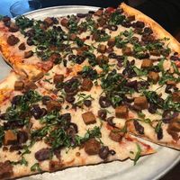 Vegan half pie with field roast, daiya, basil, kalamata olives at Rocco's in Seattle