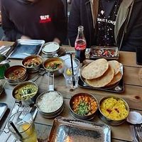 I chose the vegan pot-luck Tiffin Four Tiers (a mixture of carbs and curry that they choose for you!). Everything they brought tasted amazing.  at Mowgli in Manchester
