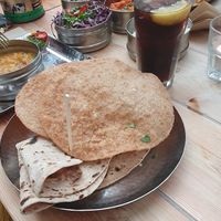 Roti bread and puri (purple dish in the back ground is 'Mowgli Slaw') at Mowgli in Manchester