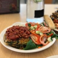 Spinach Butternut Squash lasagna. Made with tofu ricotta and topped with fresh chunky marinara. Served with a salad (spinach, tomato, carrot, cucumber, bell pepper) and house dressing.  at Wild Rabbit Cafe and Health Bar in Flagler Beach