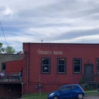 Side of the building with outdoor seating on the back patio  at Burrito Union in Duluth