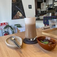 Sesame chai and a dessert (sesame pudding and sesame chocolate cake)  at Gomacro in Kyoto