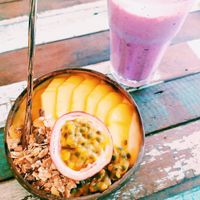 Mango smoothie bowl (no yoghurt/honey - made with coconut milk) and very berry smoothie. 😋 at Qcumber in Khao Lak