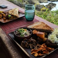 Breakfast platter and ChickVeg Piadina with the view at Vivo Cafe & Restaurant in West Bay