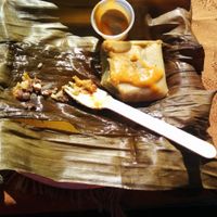 Banana leaf wrapped tamale at Guudbelly in Houston
