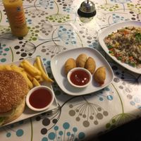 Chicken burger, curry puffs and fried rice! at Inala Vegan Restaurant in Inala