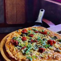 Delicious pizza from sprouted whole wheat flour with a medley of toppings! at Terrasen Cafe in Hyderabad