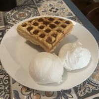 vanilla ice cream with waffles and maple syrup. The ice cream is usually quite decent but this time was very sandy texture   at Terrasen Cafe in Hyderabad