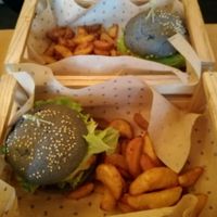 Delicious Black Bun Burger at Flower Burger - Viale Vittorio Veneto in Milan