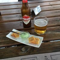 Little appetizers served with our pre-meal drinks : chick pea omelette and alioli at BuenaVida Vegan in Tenerife