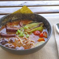 Ramen: Spicy ramen boullion with noodles, seitan, carrot, mushrooms, soy beans and vegetables of the day. at BuenaVida Vegan in Tenerife