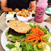 quinoa burger with salad, falafels, chips and wild berry smoothie at BuenaVida Vegan in Tenerife