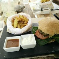 Burger ";Tofu y Algas"; with fries and pineapple/kiwi smoothie at BuenaVida Vegan in Tenerife