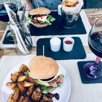 Burger with fried potatoes  at BuenaVida Vegan in Tenerife