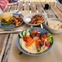 For me: Hummus, vegetables, baked potato. For her: beyond, baked potato. at BuenaVida Vegan in Tenerife